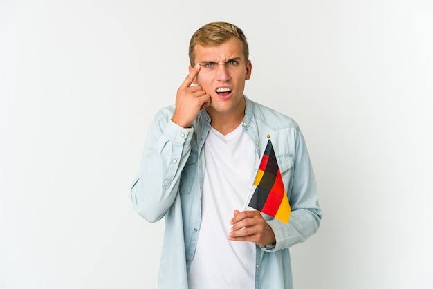 Premium Photo Young Caucasian Man Holding A German Flag Isolated On