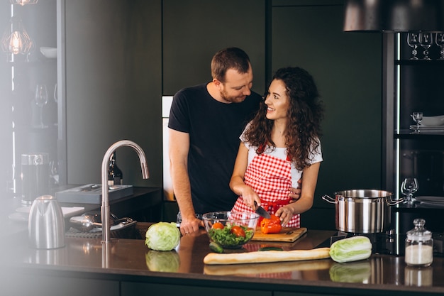Young Couple Cooking Together At The Kitchen Free Photo