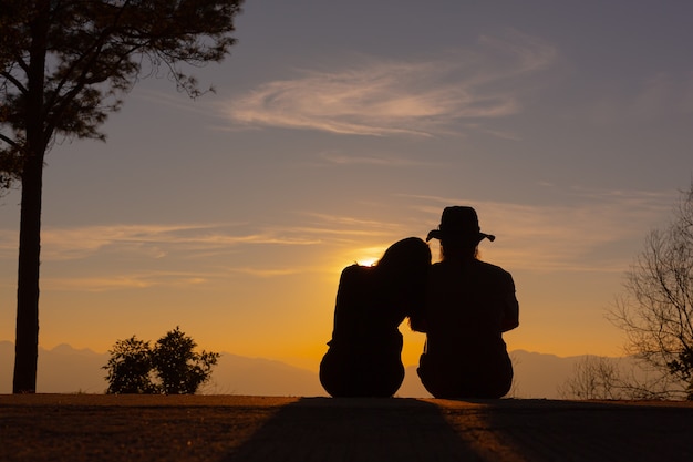 Free Photo Young Couple Enjoying The Sunset In The Mountain