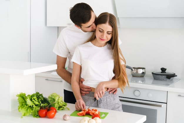Free Photo | Young couple in kitchen cooking