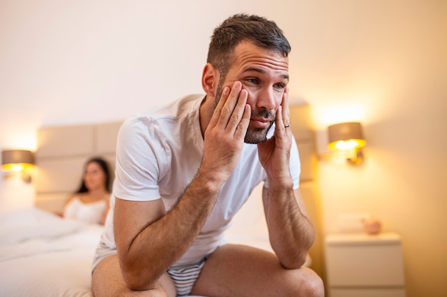 Young couple lying in bed frustrated thinking about relationships Premium Photo