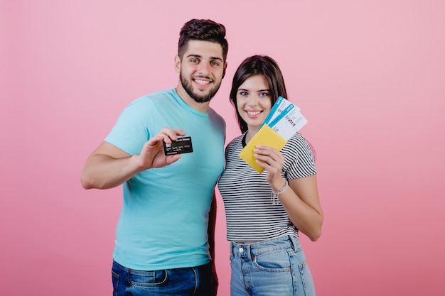 premium-photo-young-couple-man-and-woman-with-plane-tickets-and