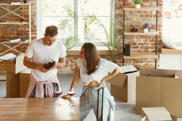 Free Photo | Young couple moved to a new house or apartment. drinking ...