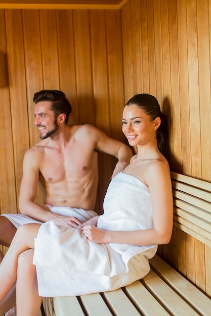 Young Couple In The Sauna Premium Photo.