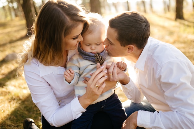 Free Photo | A young couple walks in the woods with a little boy