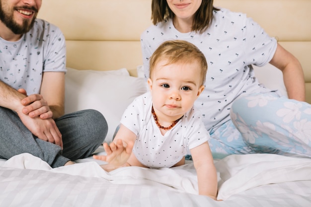 Young couple with baby in the morning Free Photo