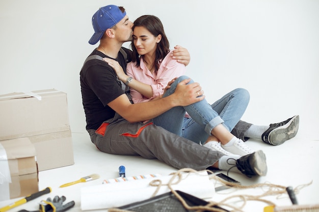 The young and cute family repairs the room Free Photo