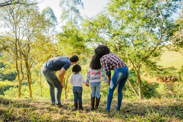 Young family exploring countryside Photo | Free Download