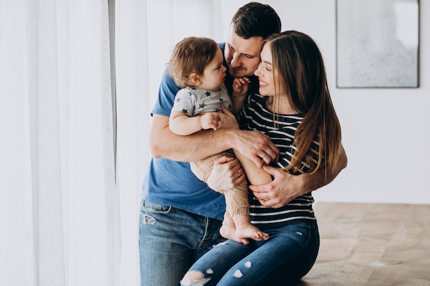 Young family with their little son at home Free Photo