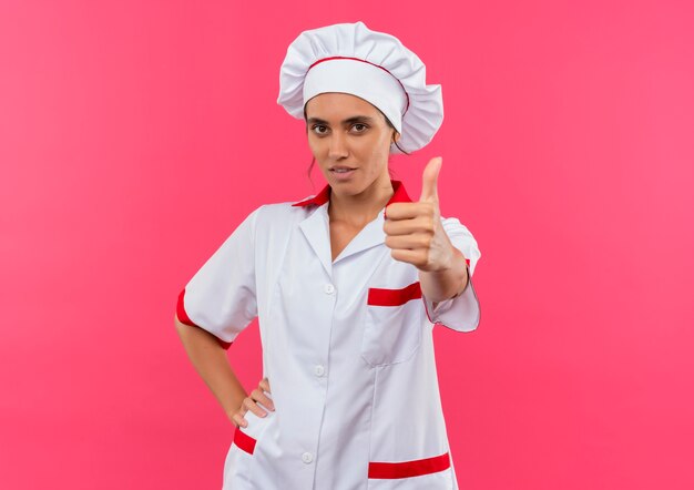 Free Photo Young Female Cook Wearing Chef Uniform Her Thumb Up And Putting Hand On Hip On 3683