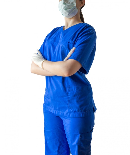 Download Young female doctor in a blue medical uniform standing ...