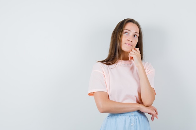 Free Photo | Young female looking upward in t-shirt, skirt and looking ...