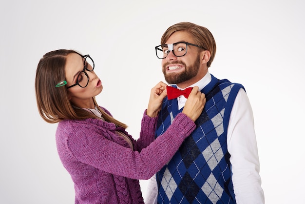 Free Photo | Young funny looking geek couple having fun isolated