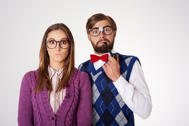 Free Photo | Young funny looking geek couple having fun isolated