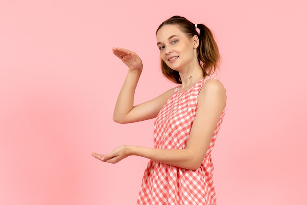 Free Photo Young Girl In Cute Pink Dress With Excited Expression On Her Face On Pink