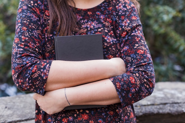 Young girl holding a book Free Photo