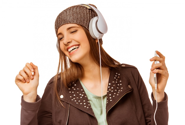 Young girl listening to music with headphones. Premium Photo