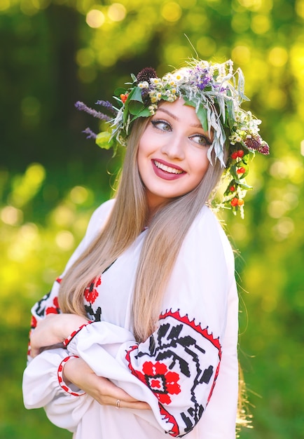 Premium Photo | A young girl of slavic appearance with a wreath of wild ...