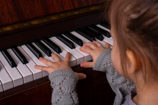 Premium Photo | Young girls practicing piano