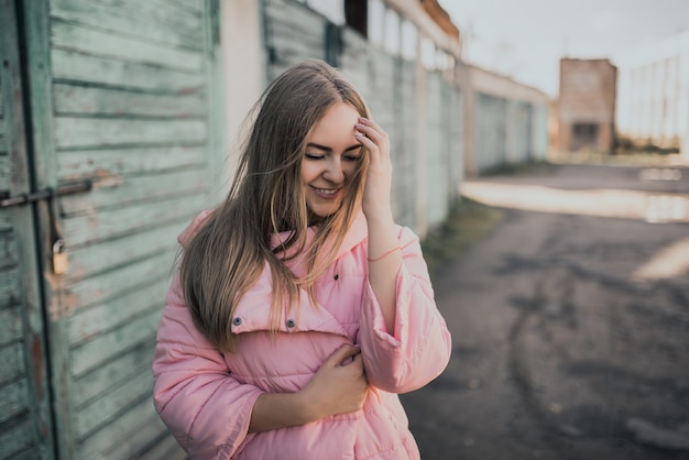 Premium Photo Young Gorgeous Blonde Girl Dressed Fashion Pink Jacket And Blue Jeans