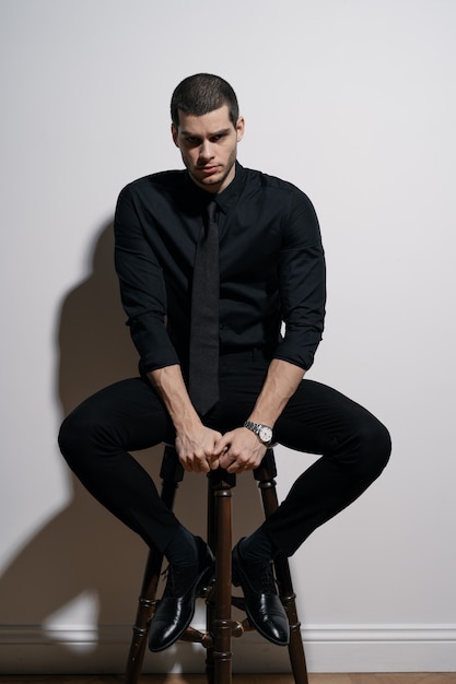 black t shirt with black suit