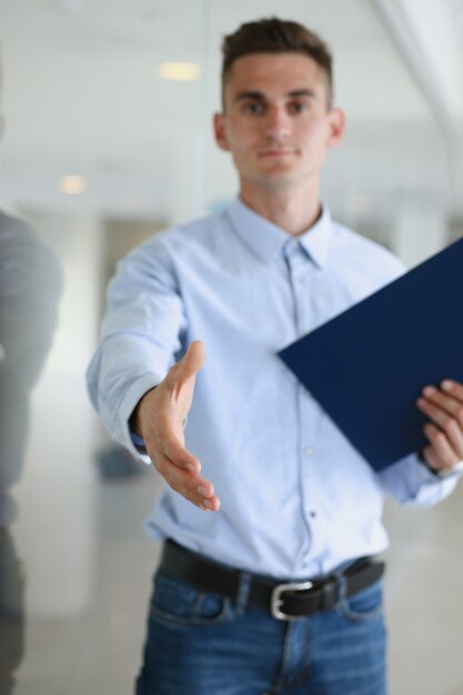 Premium Photo | Young handsome man pull hand