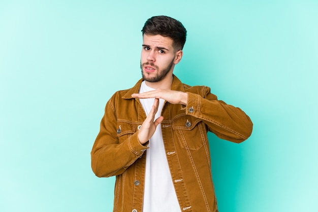 Premium Photo | Young handsome man showing a timeout gesture