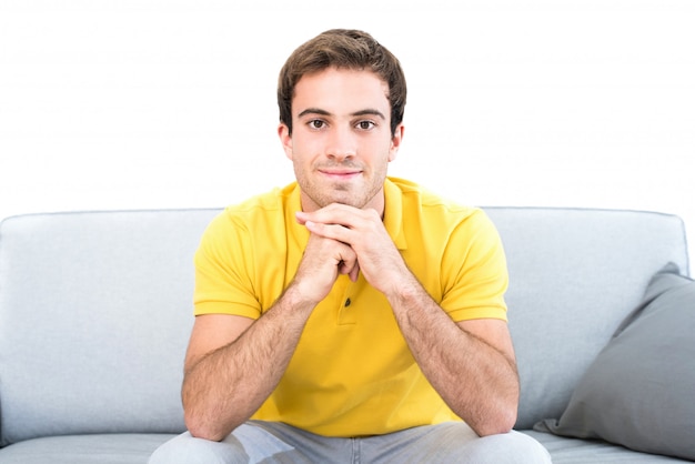 Handsome Man Sitting Down In Living Room