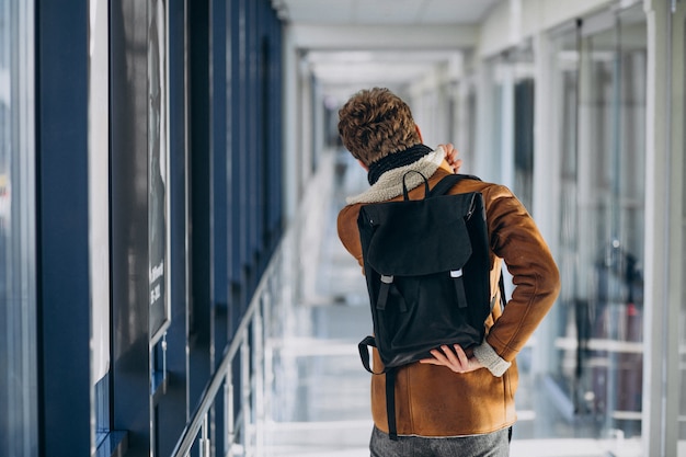 Free Photo | Young handsome man travelling with bag