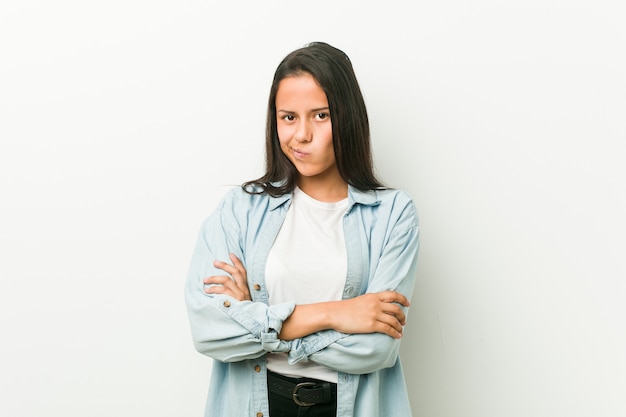 Premium Photo Young Hispanic Woman Frowning Face In Displeasure Keeps Arms Folded