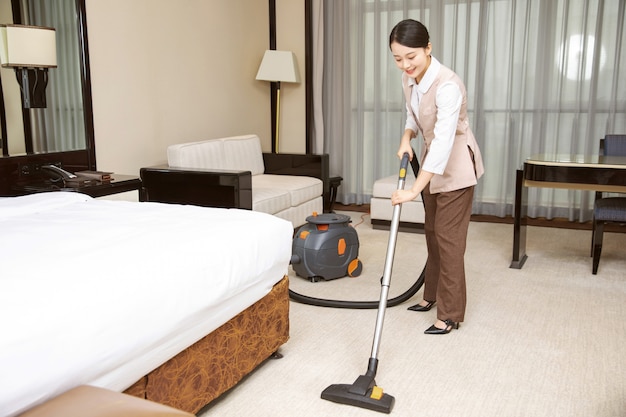 Premium Photo Young Hotel Maid Cleaning Hotel Rooms