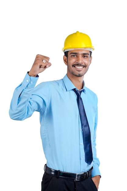 Premium Photo | Young indian engineer wearing yellow color hard hat and ...