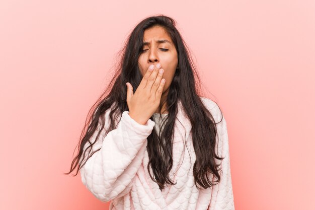 Download Free Young Indian Woman Wearing Pajama Yawning Showing A Tired Gesture Use our free logo maker to create a logo and build your brand. Put your logo on business cards, promotional products, or your website for brand visibility.