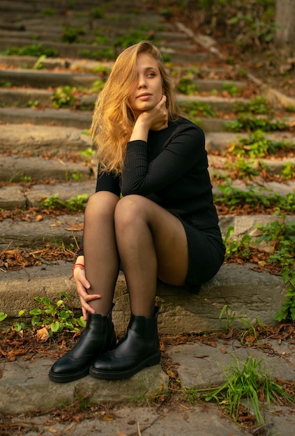 Premium Photo | The young lady sitting on the abandoned stairs