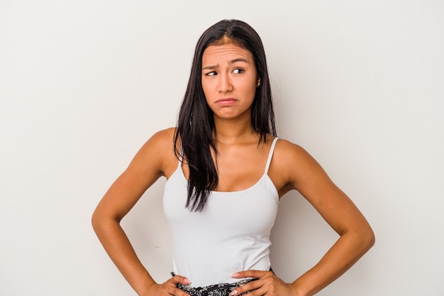 Premium Photo | Young latin woman isolated on white background confused ...