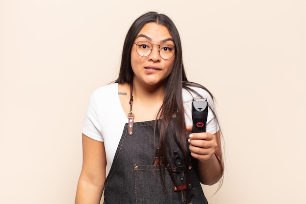 Premium Photo | Young latin woman looking puzzled and confused, biting ...