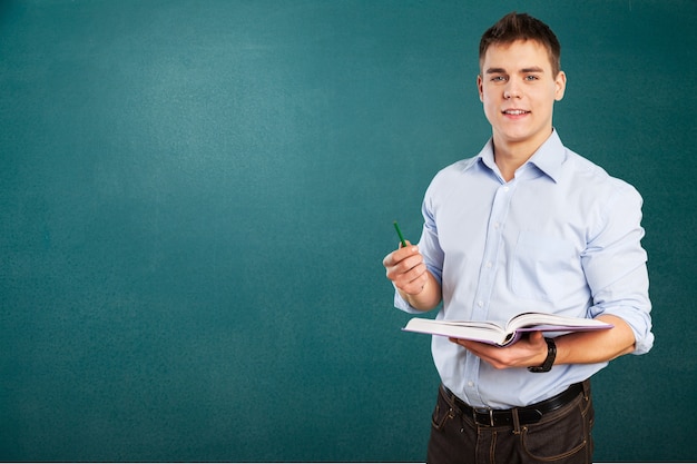 Premium Photo Young Male Teacher Standing In Class