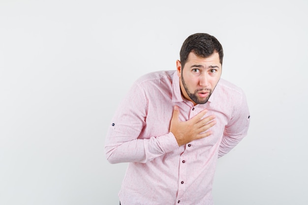 Free Photo | Young man bowing head for greeting in pink shirt and ...