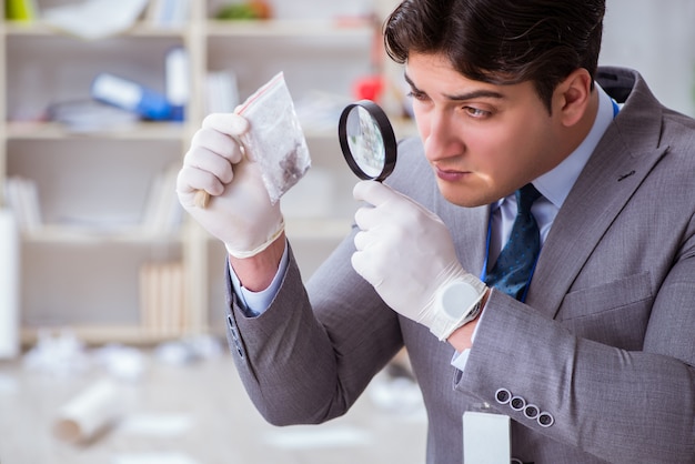Young man during crime investigation in office Premium Photo