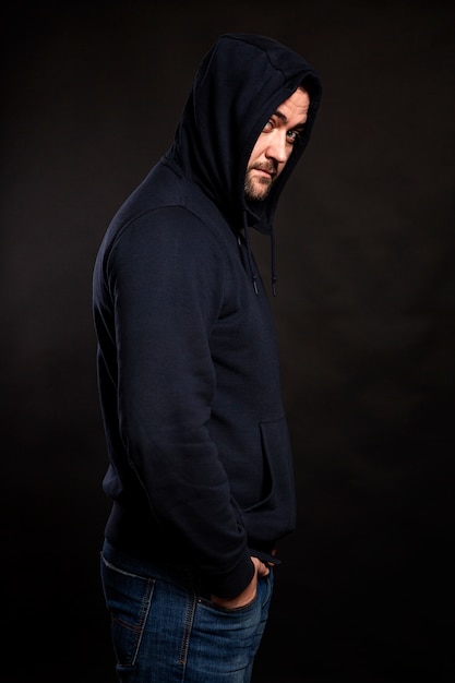 man in a black hoodie