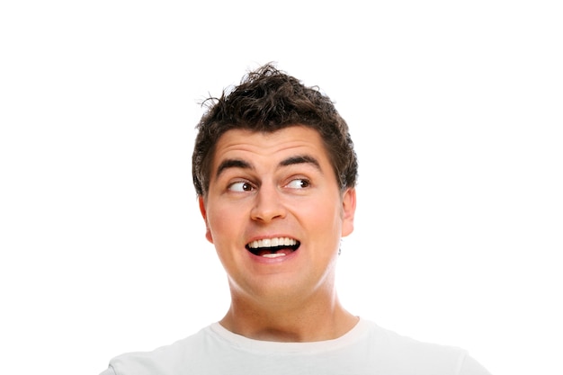 Premium Photo | A young man making funny faces over white background