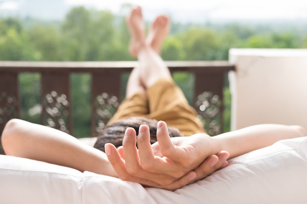 Young man relax on bed and enjoying mountain view Free Photo