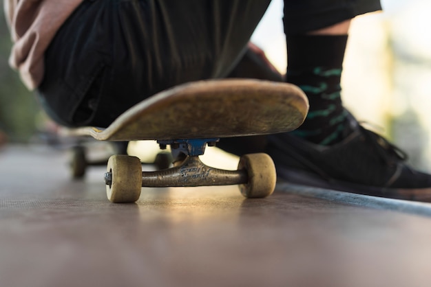 Free Photo | Young man sitting on a skateboard