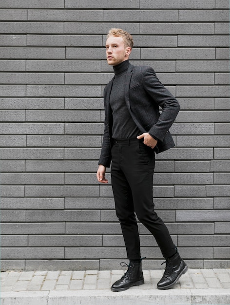 Young Man On The Street With One Hand In His Pocket Free Photo