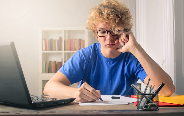 Premium Photo | Young man studying