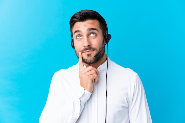 Premium Photo | Young man thinking with headphones