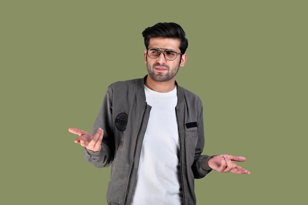 Premium Photo | Young man wearing jacket and glasses crazy, confused ...