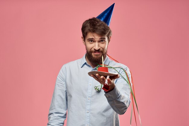 Premium Photo | Young man with a celebratory cake with slices ...