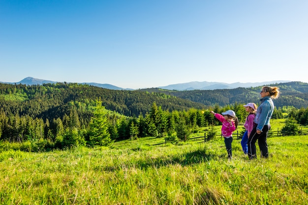 Premium Photo | Young mother and two little daughters travelers