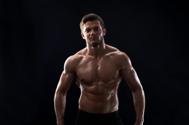 Portrait Of Shirtless Bodybuilder. Muscular Man Posing In 